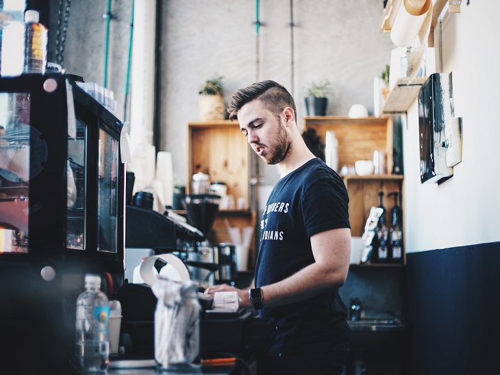 MMJ Recs - man behind store counter