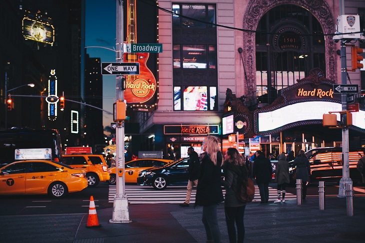 people on new york street at night